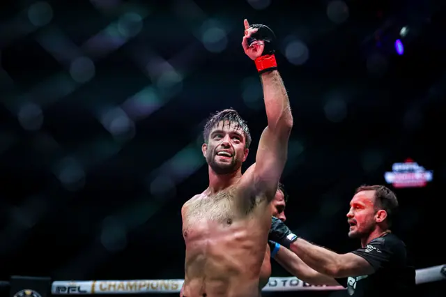 Alfie Davis with his left hand in the air after winning the PFL lightweight tournament