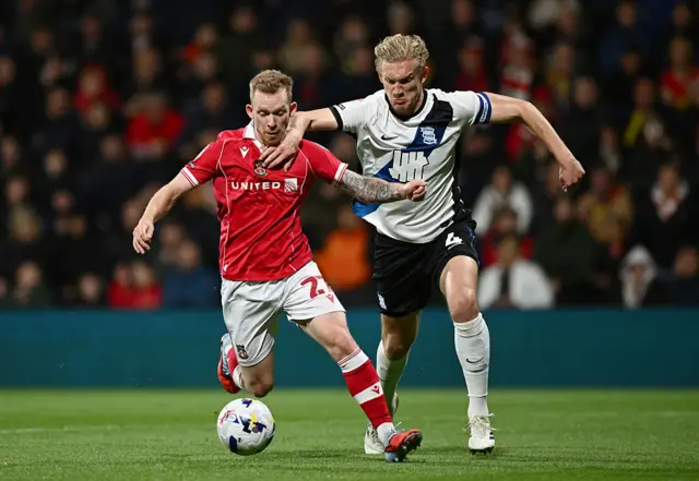 Lewis O'Brien competes for possession