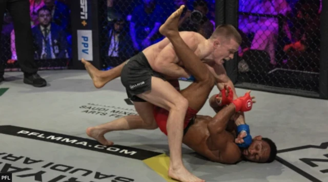 Paul Hughes punching AJ McKee