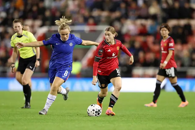Jess Park of Manchester United is challenged by Erin Cuthbert of Chelsea