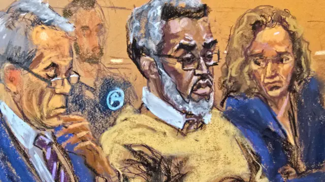 Sean "Diddy" Combs sits with his lawyers Brian Steel, and Alexandra Shapiro