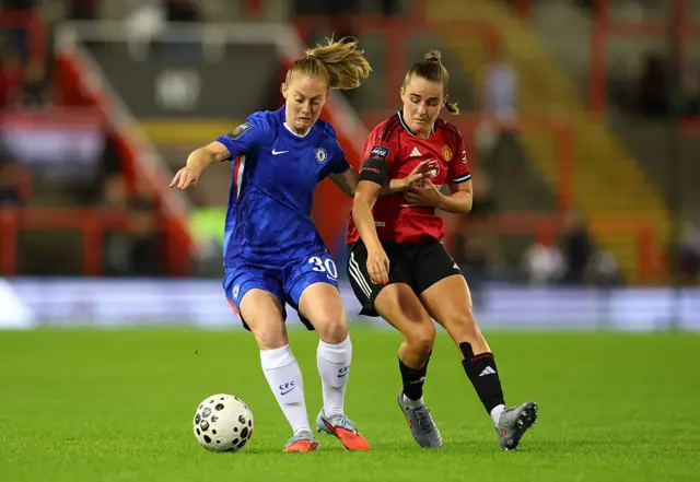Keira Walsh of Chelsea is challenged by Ella Toone
