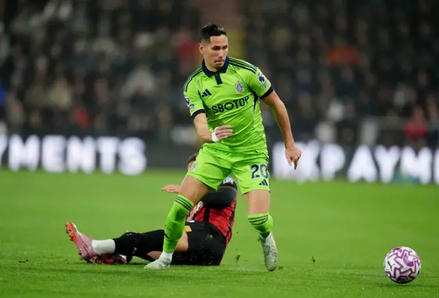 Lukic dribbles the ball forward past a Bournemouth player