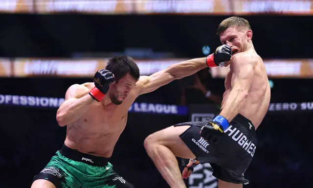 Usman Nurmagomedov lands a left hand on Paul Hughes