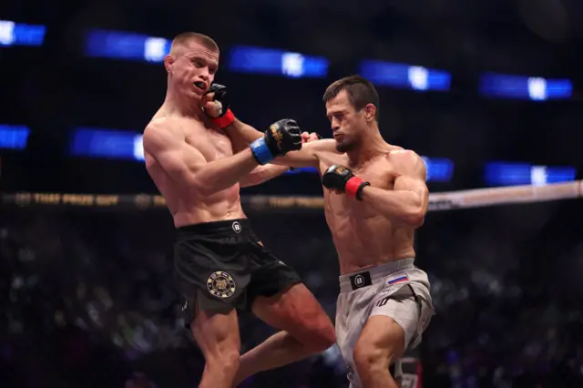 Usman Nurmagomedov punching Paul Hughes