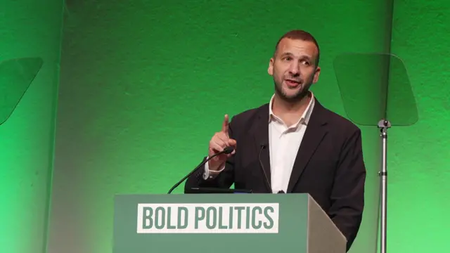 Green Party leader giving a speech