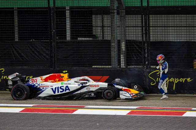 Liam Lawson walks away from his car after crashing in second practice