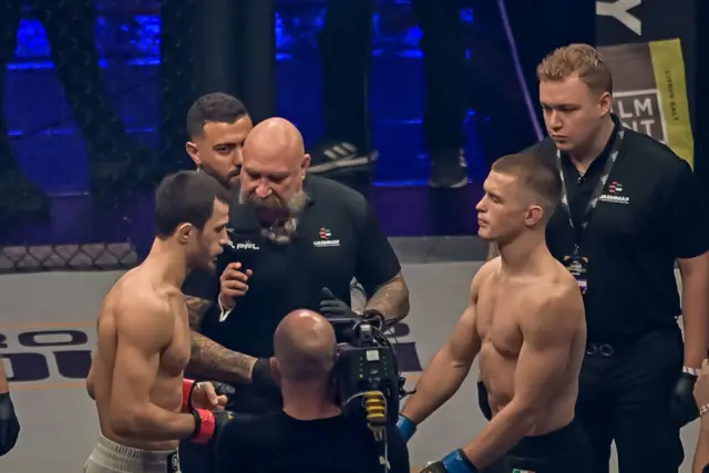 Russia's Usman Nurmagomedov (white) fights Ireland's Paul Hughes