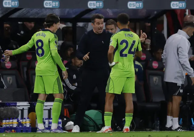 Silva chats to his players during a break