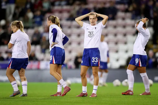 Aggie Beever-Jones of Chelsea warms up prior to the Barclays Women's Super League match between Manchester United and Chelsea FC at Leigh Sports Village on October 03, 2025 in Leigh, England.