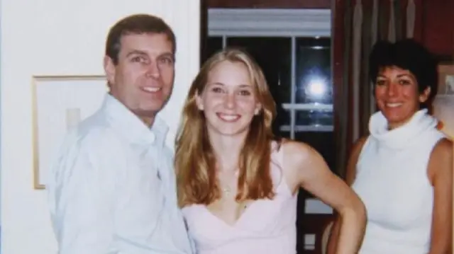 Prince Andrew (L) smiles to the camera as he stands close to Virginia Giuffre (C). Ghislaine Maxwell smiling as she stands to the right