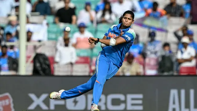 India's Radha Yadav throws the ball during the ICC Women's Cricket World Cup 2025 one-day international (ODI) semi-final match