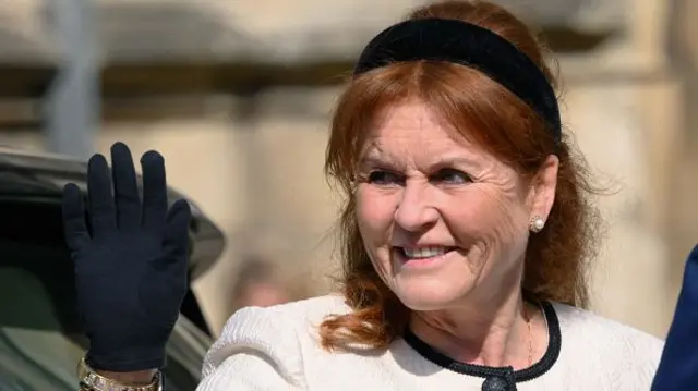 Sarah Ferguson in a white dress and black headband