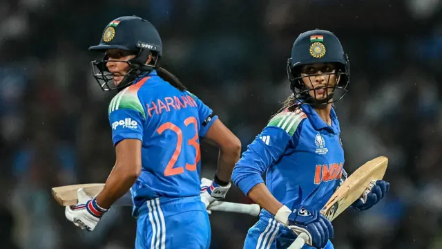 India's Jemimah Rodrigues (R) and captain Harmanpreet Kaur ru