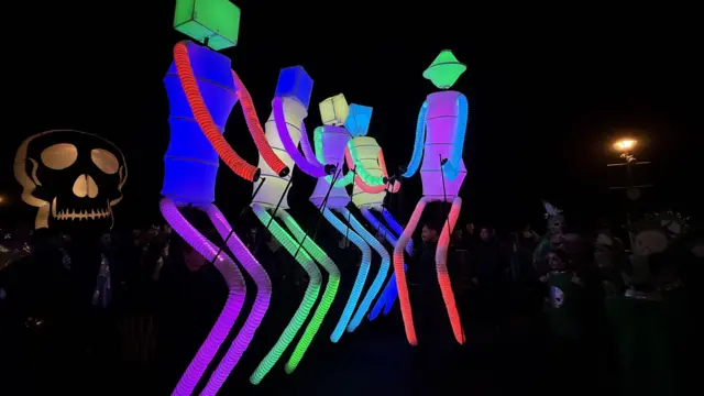 Illuminated figures are lighting up the parade