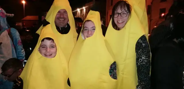 A family of four are dressed up as bananas