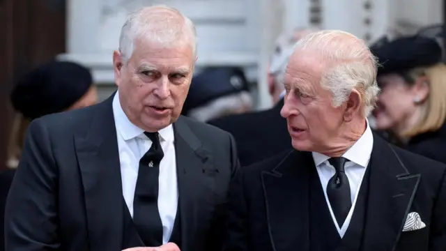 Prince Andrew speaking to the King at the funeral of the Duchess of Kent in September