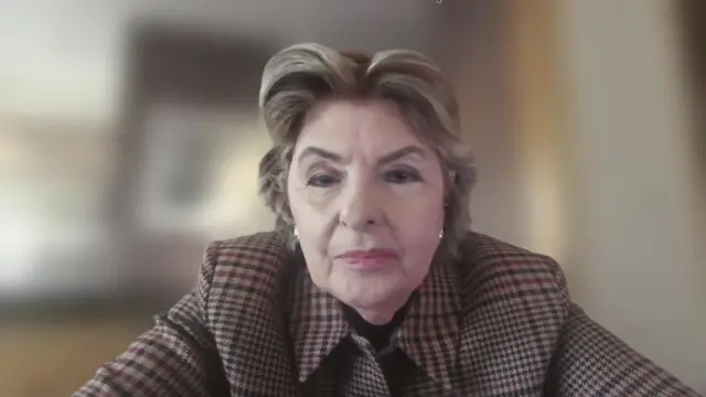 US lawyer Gloria Allred speaks to BBC News. She sits in front of camera wearing checked brown jacket. Background is blurred.