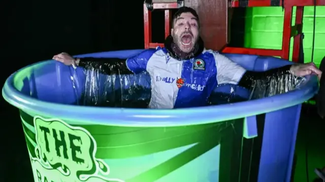 Jordan North in a gunge pool