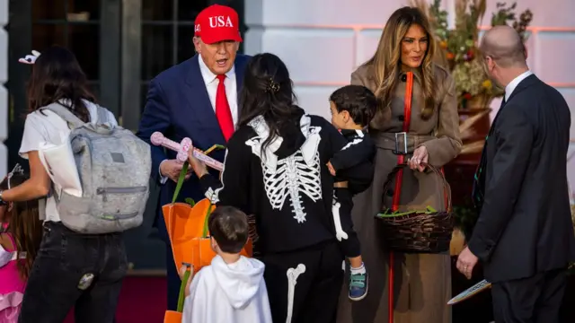 Donald Trump and Melania dispense Halloween treats
