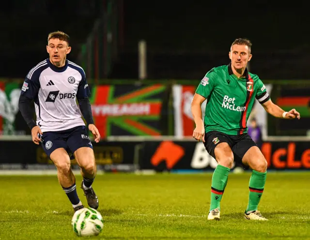 Marcus Kane runs with the ball
