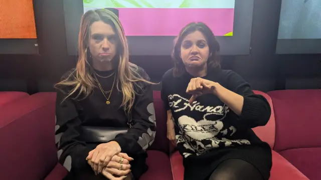 Lauren Layfield and Charlie Tee sitting on a sofa