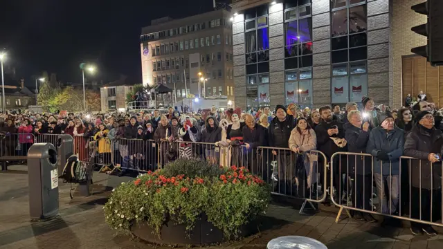 Crowds gather to watch the firework display