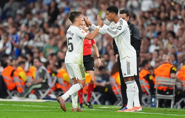 Jude Bellingham of Real Madrid is substituted on for Arda Gueler