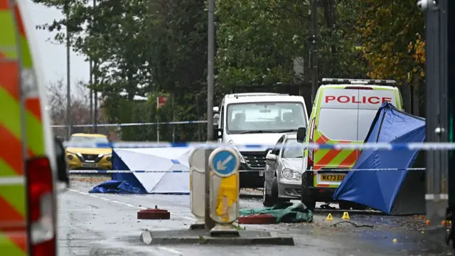 Police van on a cordoned off road in Manchester