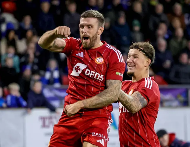 Steven McCullough celebrating scoring