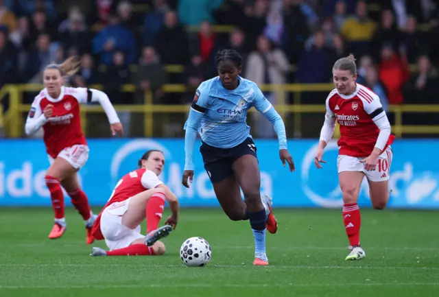 Manchester City's Khadija Shaw in action with Arsenal's Kim Little