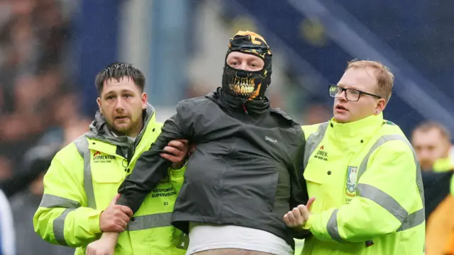 Sheffield Wednesday fans invade the pitch