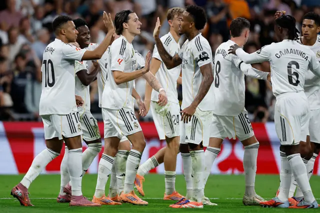 Real Madrid players celebrate their second goal scored by Real Madrid's Brazilian forward Vinicius Junior