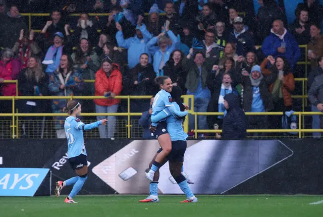Manchester City's Iman Beney celebrates scoring their third goal with Khadija Shaw