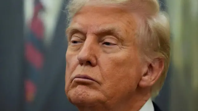 A close up of Donald Trumps face