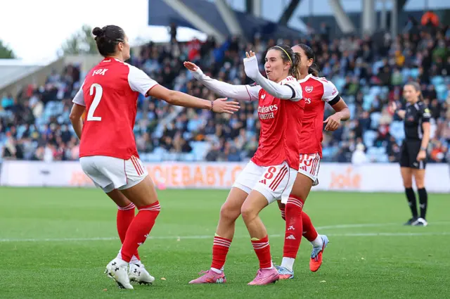 Mariona Caldentey of Arsenal celebrates with teammates after scoring his team's first goal during the Barclays Women's Super League match between Manchester City and Arsenal at Joie Stadium on October 04, 2025 in Manchester, England.