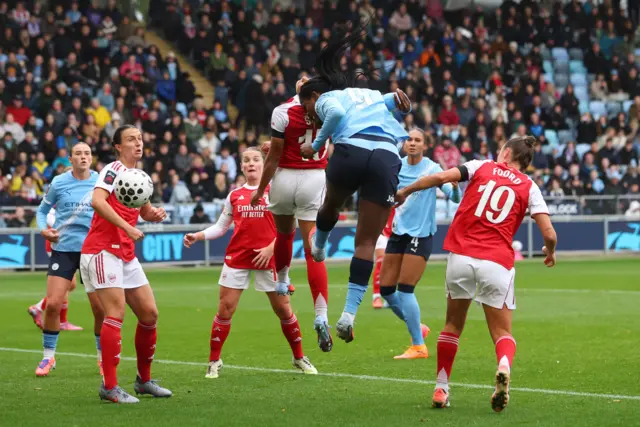 Manchester City's Khadija Shaw heads at goal.
