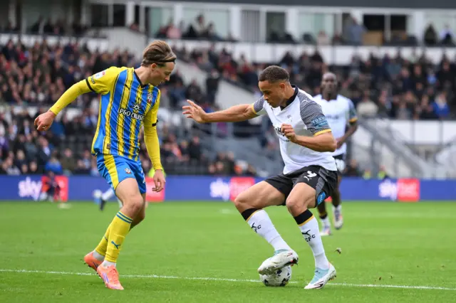 Carlton Morris of Derby County is under pressure from Caspar Jander of Southampton