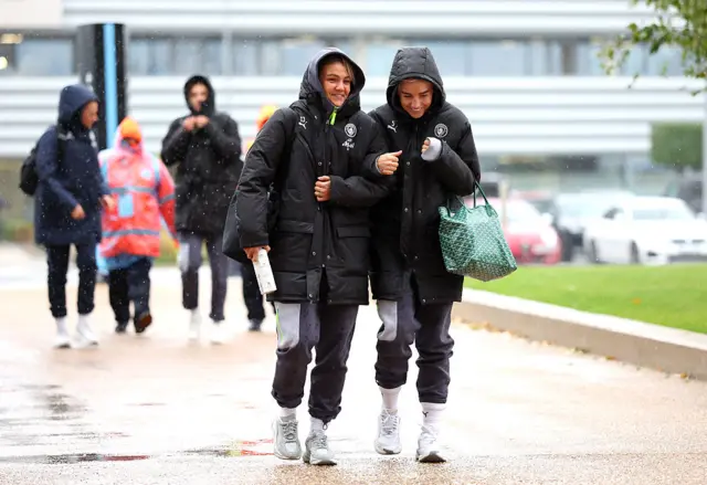 Laura Wienroither and Alex Greenwood of Manchester City arrive at the stadium prior to the Barclays Women's Super League match between Manchester City and Arsenal at Joie Stadium on October 04, 2025 in Manchester, England.