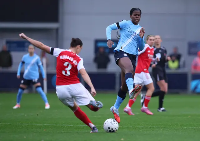 Arsenal's Lotte Wubben-Moy in action with Manchester City's Khadija Shaw