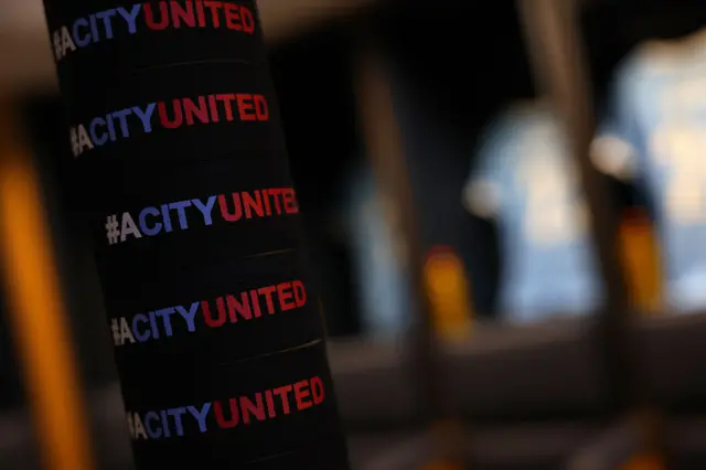 A detailed view of '#ACityUnited' armbands