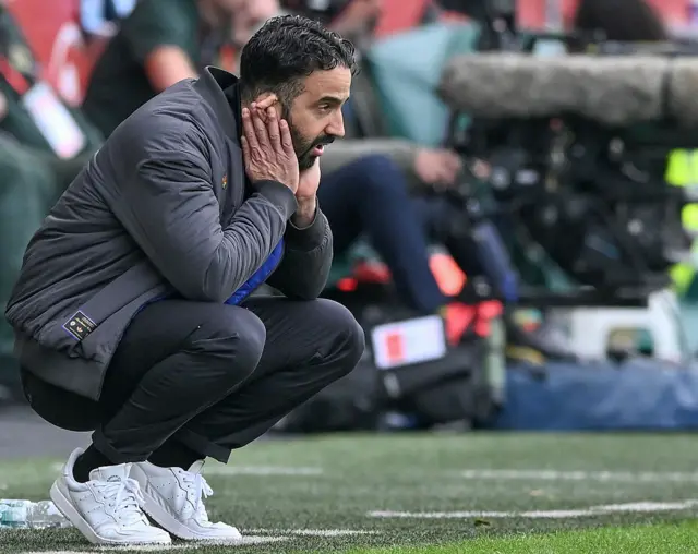 Amorim crouches and covers his ears in frustration