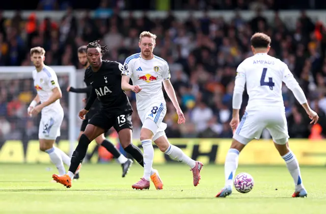Destiny Udogie of Tottenham Hotspur and Sean Longstaff of Leeds United compete for the ball