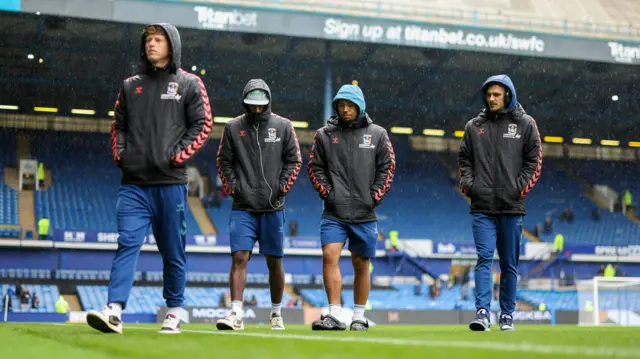 Coventry players inspect the Hillsborough pitch this morning