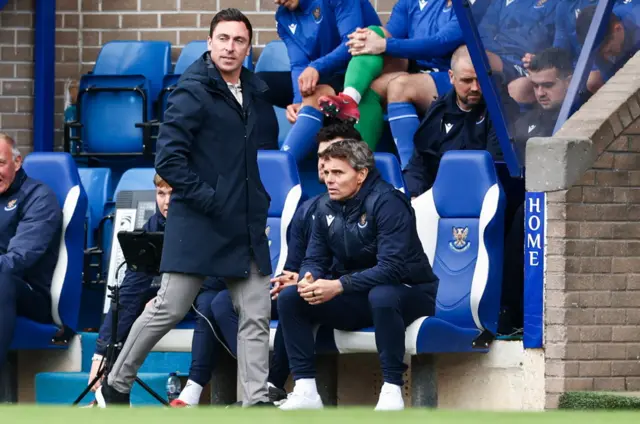 Scott Brown wanders past St Johnstone boss Simo Valakari