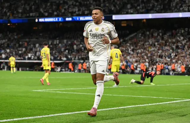 Kylian Mbappe of Real Madrid scores his team's third goal