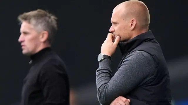 Liam Manning on the touchline