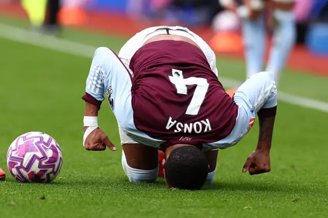 Ezri Konsa of Aston Villa goes down injured