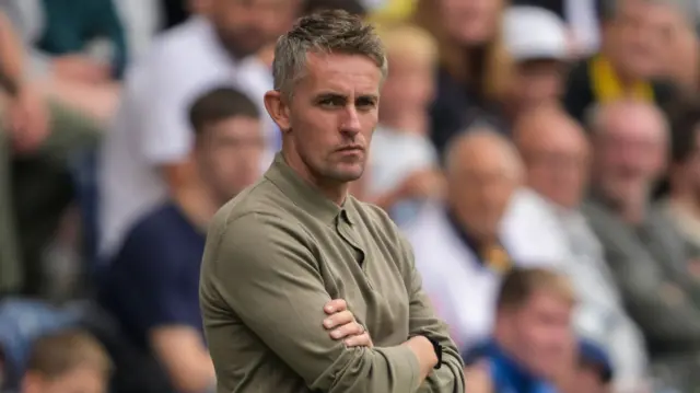 Kieran McKenna with arms folded on the sideline