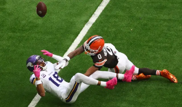 Justin Jefferson is tackled by Greg Newsome